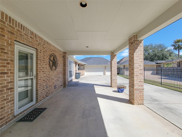 view of patio featuring fence