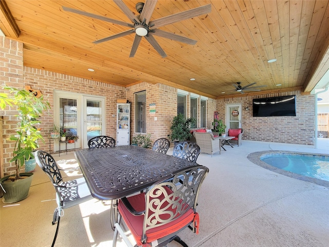 view of patio featuring outdoor dining area and ceiling fan