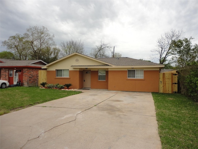 single story home with a front yard and stucco siding