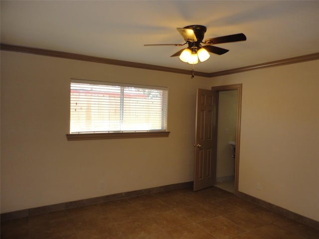 empty room with ornamental molding, ceiling fan, and baseboards