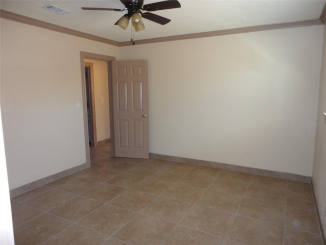 empty room featuring ornamental molding, visible vents, baseboards, and a ceiling fan