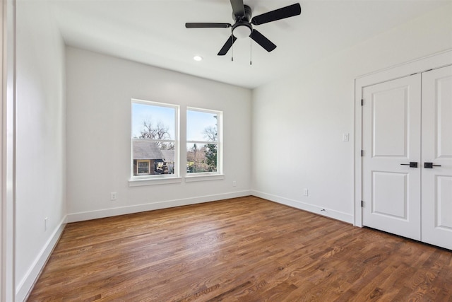 unfurnished bedroom with recessed lighting, baseboards, wood finished floors, and a ceiling fan