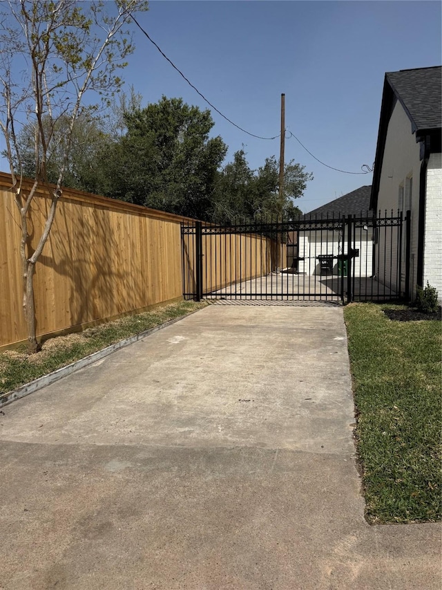 view of gate featuring fence