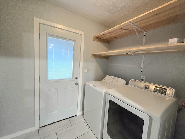 laundry area featuring laundry area and washing machine and dryer