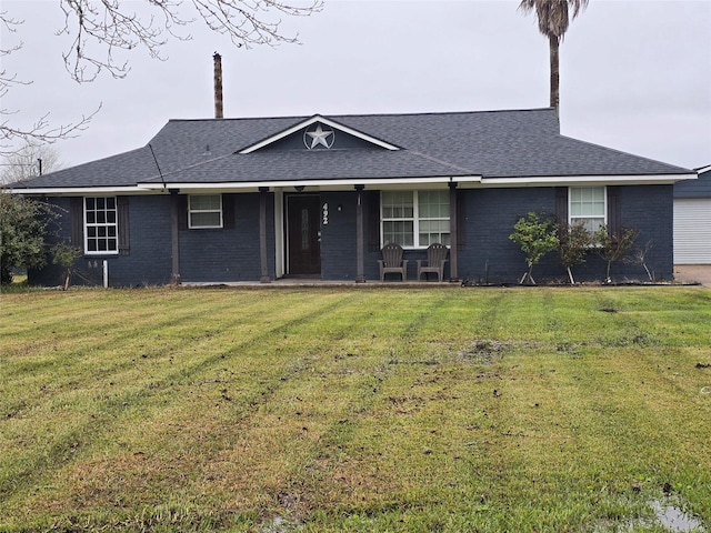 ranch-style house with a shingled roof, brick siding, a porch, and a front lawn