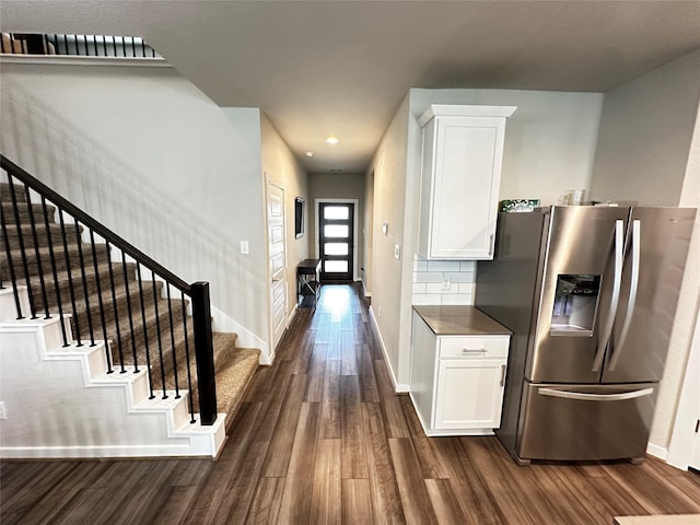 kitchen with white cabinets, dark wood finished floors, and stainless steel fridge with ice dispenser