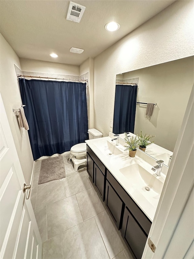 7418 Victoria Brook Trce, Richmond, TX 77407 - bathroom with toilet, tile patterned flooring, double vanity, recessed lighting, and a shower with curtain