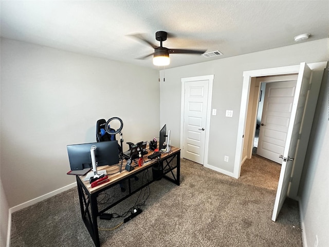 office area featuring carpet floors, visible vents, and baseboards