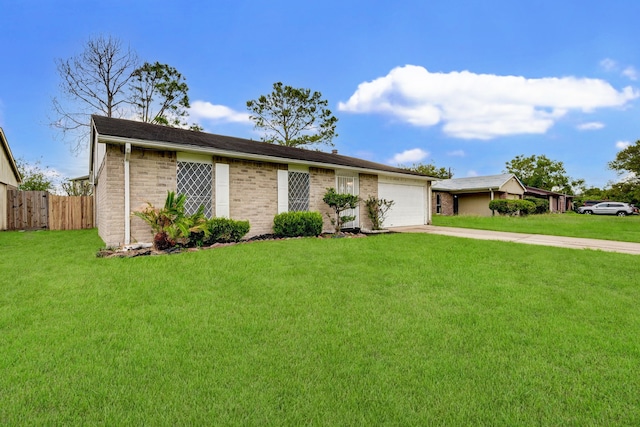 single story home featuring brick siding, a front yard, fence, a garage, and driveway