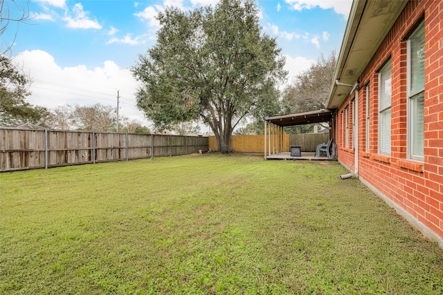 view of yard with a fenced backyard