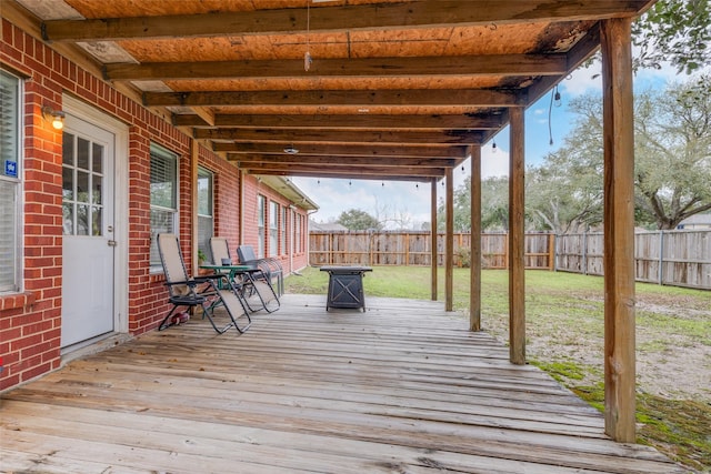 deck featuring a yard and a fenced backyard