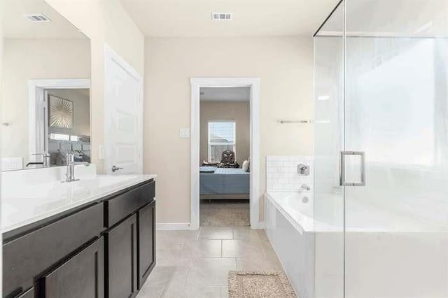 ensuite bathroom featuring a garden tub, visible vents, a stall shower, connected bathroom, and tile patterned flooring