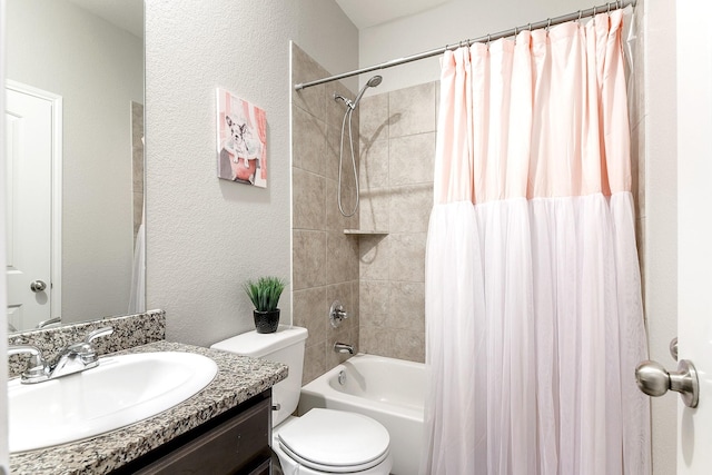 full bathroom featuring shower / bath combination with curtain, a textured wall, vanity, and toilet