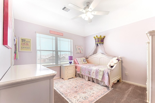 bedroom with ceiling fan, dark colored carpet, visible vents, and baseboards