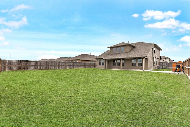 view of yard with a patio, cooling unit, and a fenced backyard