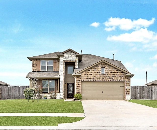 view of front of property with a front yard, brick siding, fence, and driveway