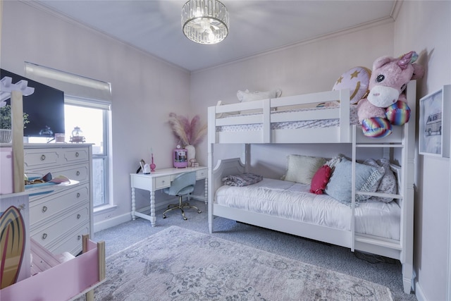 carpeted bedroom with baseboards and crown molding