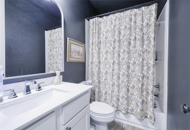 bathroom featuring toilet, vanity, and shower / bath combination with curtain