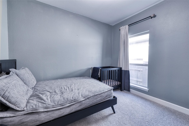 carpeted bedroom with baseboards