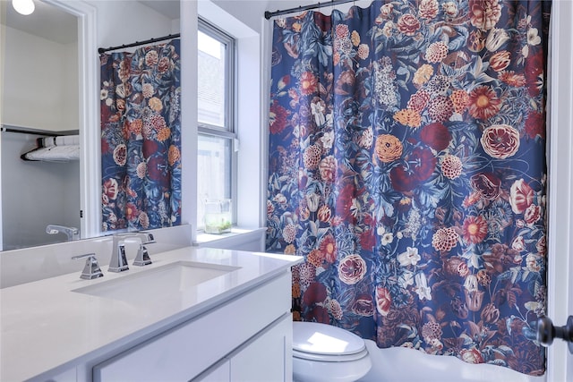 bathroom with vanity, a shower with curtain, and toilet