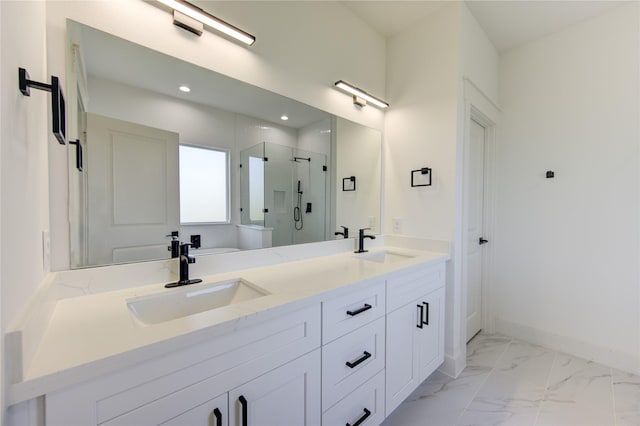 bathroom featuring double vanity, marble finish floor, a stall shower, and a sink