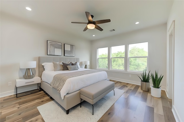 bedroom with recessed lighting, visible vents, baseboards, and light wood-style flooring