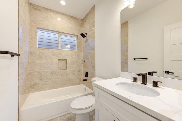 bathroom with toilet, vanity, and shower / bathtub combination