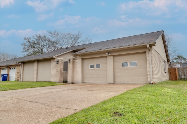 ranch-style house with concrete driveway, brick siding, an attached garage, and a front yard