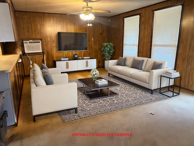 living area with carpet, a wall unit AC, ceiling fan, and wooden walls