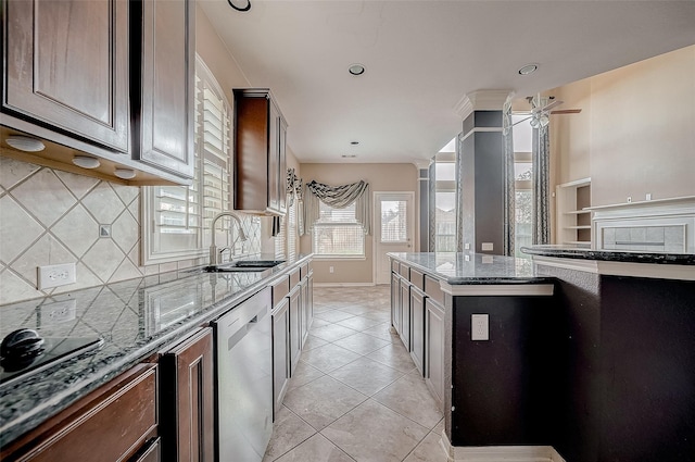 kitchen featuring light stone counters, light tile patterned floors, stainless steel dishwasher, a sink, and dark brown cabinets