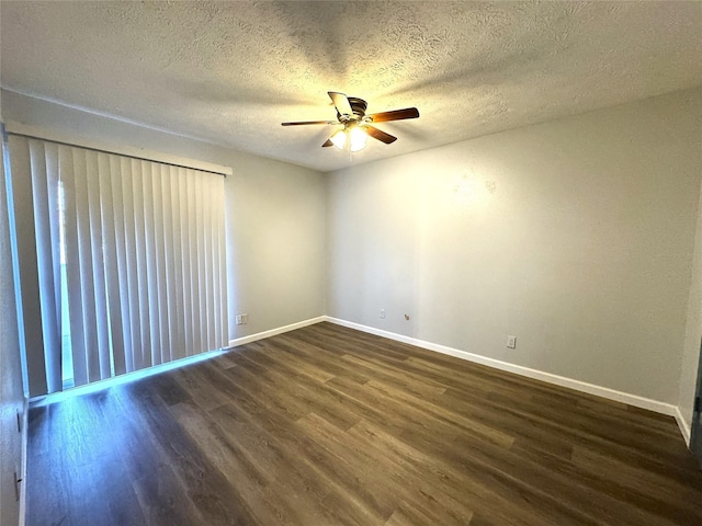 unfurnished room featuring dark wood-style floors, ceiling fan, baseboards, and a textured ceiling