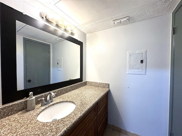 bathroom with electric panel, visible vents, and vanity