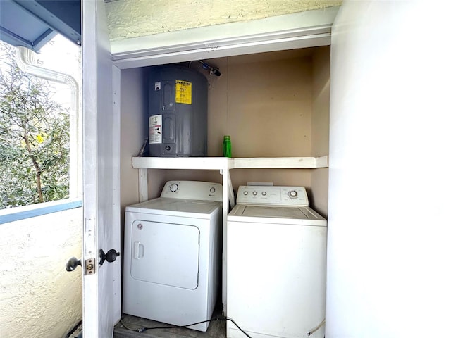 clothes washing area featuring laundry area and washing machine and dryer