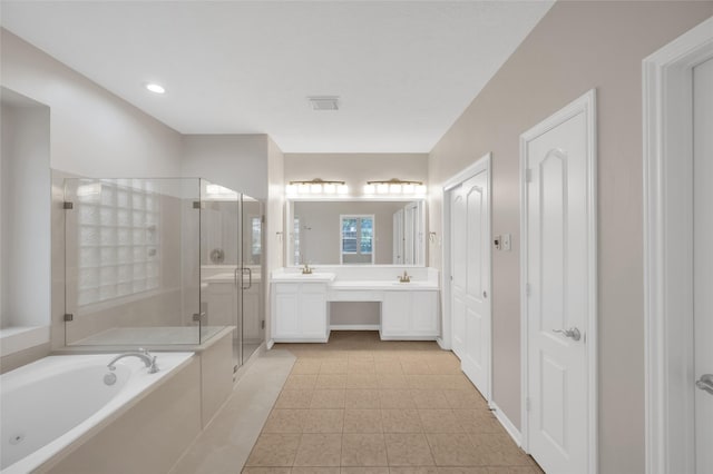 full bathroom with a garden tub, a sink, visible vents, a shower stall, and double vanity