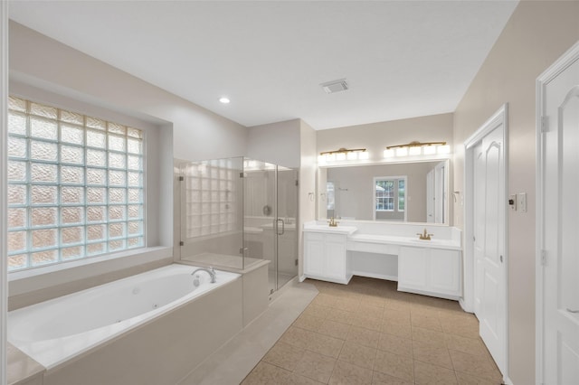 bathroom featuring double vanity, a stall shower, visible vents, a bath, and recessed lighting