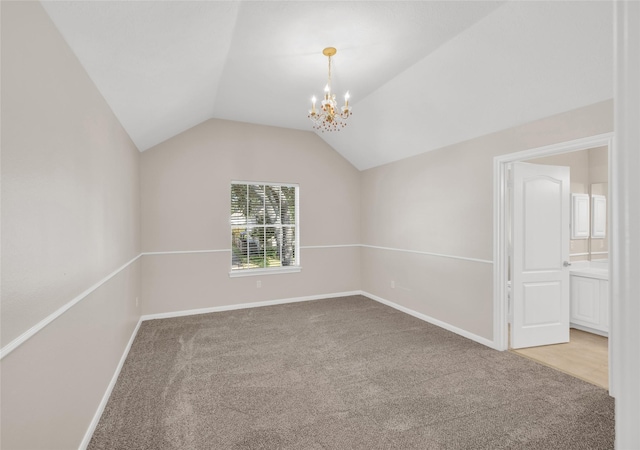 unfurnished room with vaulted ceiling, baseboards, a chandelier, and light colored carpet