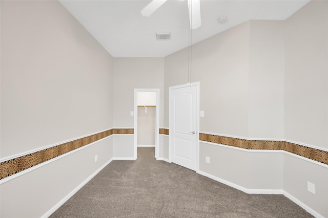 unfurnished room featuring a ceiling fan, baseboards, visible vents, and carpet flooring