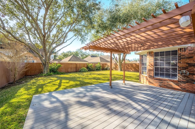 wooden deck with a fenced backyard, a pergola, and a yard