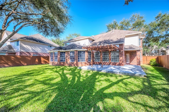 back of property featuring a patio, a fenced backyard, brick siding, a shingled roof, and a yard