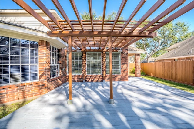 view of patio / terrace with fence, a deck, and a pergola