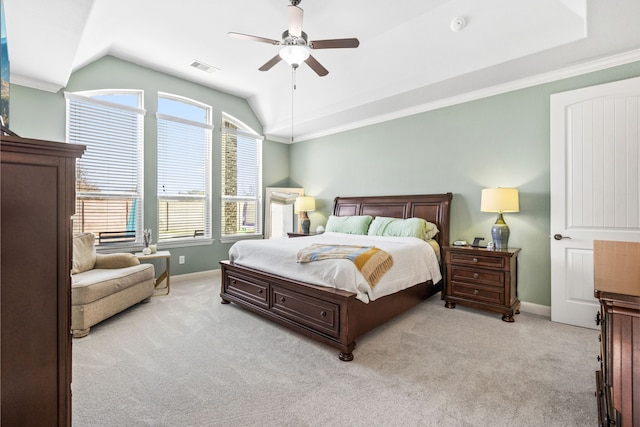 bedroom with lofted ceiling, light colored carpet, and baseboards