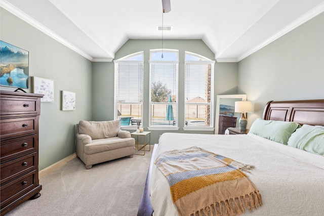 bedroom with vaulted ceiling, ornamental molding, visible vents, and light colored carpet