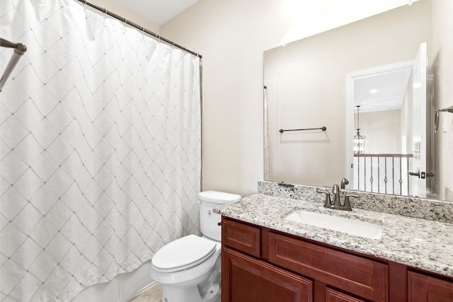 bathroom with toilet, shower / tub combo with curtain, and vanity