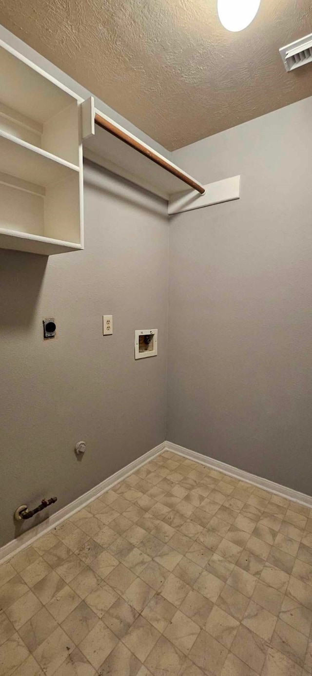 clothes washing area featuring hookup for a gas dryer, laundry area, visible vents, and light floors