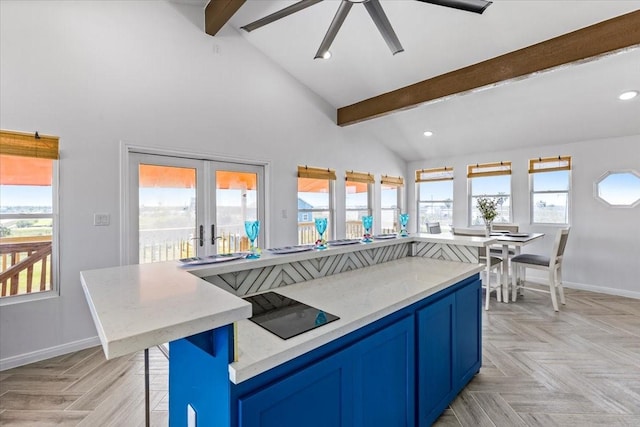 kitchen with beam ceiling, blue cabinets, recessed lighting, and baseboards