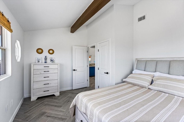 bedroom with beamed ceiling, baseboards, and visible vents