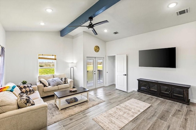 living room with visible vents, vaulted ceiling with beams, wood tiled floor, and french doors