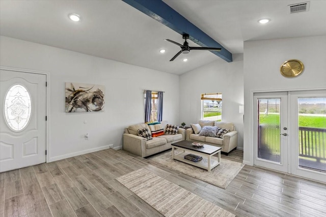 living area with wood finished floors, visible vents, baseboards, vaulted ceiling with beams, and recessed lighting