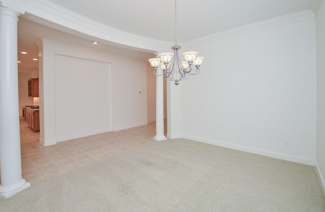 unfurnished room with light carpet, decorative columns, and ornamental molding