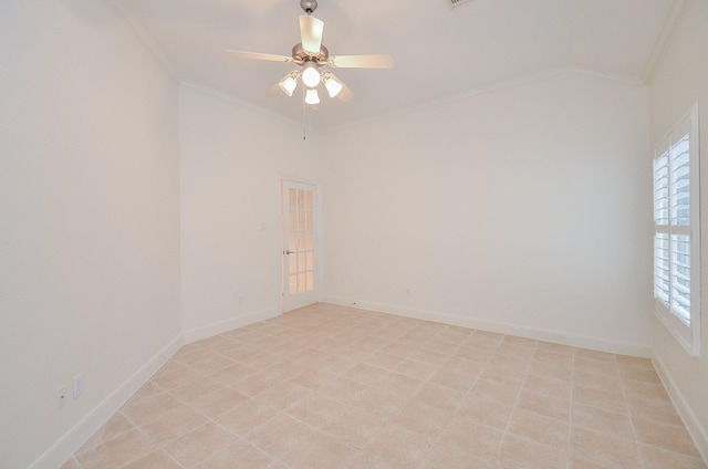 spare room with baseboards, ornamental molding, and ceiling fan